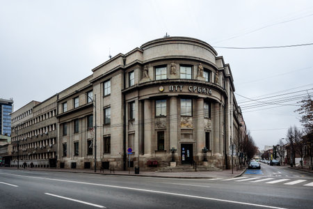 Nis, Serbia - December 13, 2020: Nis with with Post Office building and kight Sunday traffic on a cloudy December day. Nis is the third largest city of Serbia, Europeのeditorial素材