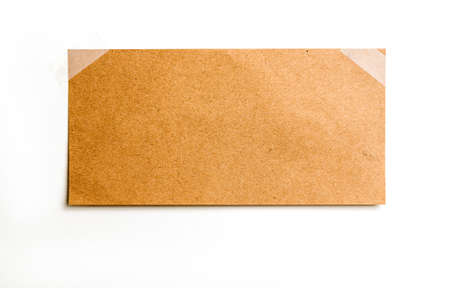 Vintage note paper on white background, attached by adhesive tapeの写真素材