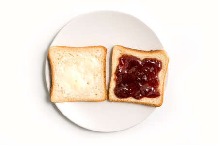 Butter and Jam or Jelly sandwich in a white plate on a white background - top viewの写真素材
