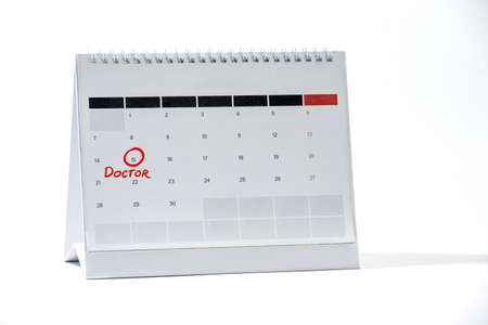 Red circle marking Doctor Appointment on calendar sheet. Mark on the calendar - Date of calendar with red circle.の写真素材