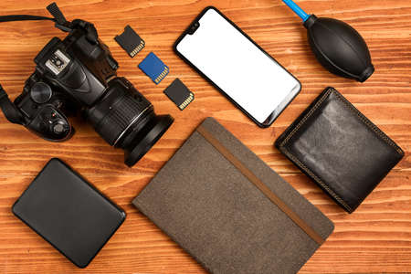 Journalistic equipment - notebook, phone, camera, lens, wallet and different objects. Modern 

investigative concept. Freelancers outfit. Clipping mask for screenの写真素材