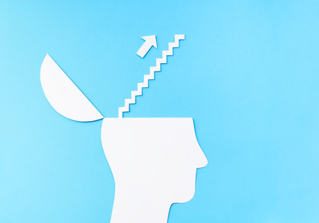 Uplifting and business prosper Concept, Paper Cut Open head with stairs up to the cloudの写真素材