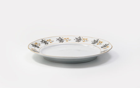 Luxury Vintage Porcelain tableware - Small Plate on white background, side viewの写真素材
