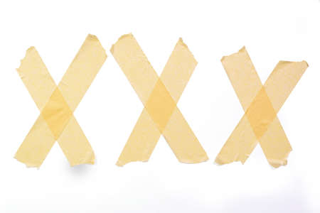 Three X made of adhesive tape on white background, with cliping pathの写真素材
