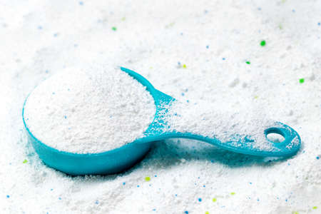 Blue cup or scoop of white powder Detergent for clothes washingの写真素材