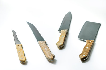 Set of three kitchen knifes and a Cleaver isolated on white background with clipping path includedの写真素材