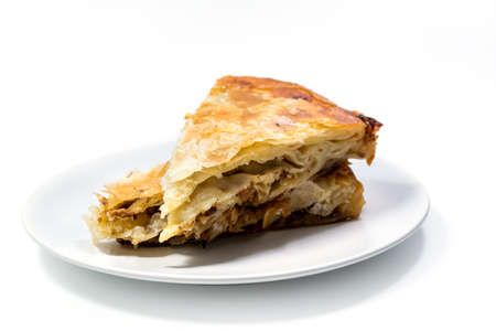 Burek Traditional Pie With Meat Served On The Plate. Traditional Balkan breakfast. Isolated on white background with clipping path includedの写真素材