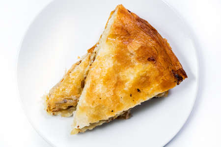 Burek Traditional Pie With Meat Served On The Plate with ustenils. Traditional Balkan breakfast. Isolated on white background. Top Viewの写真素材