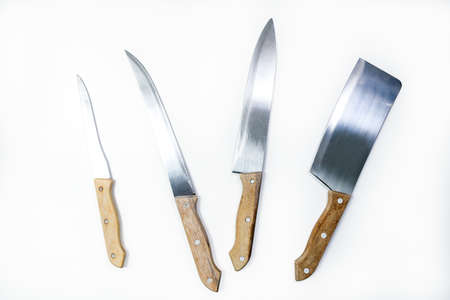 Set of three kitchen knifes and a Cleaver isolated on white background with clipping path included....