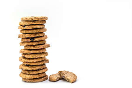 Close up delicious homemade milk cookie or biscuit with Raisin stack - isolated on white background with clipping pathの写真素材