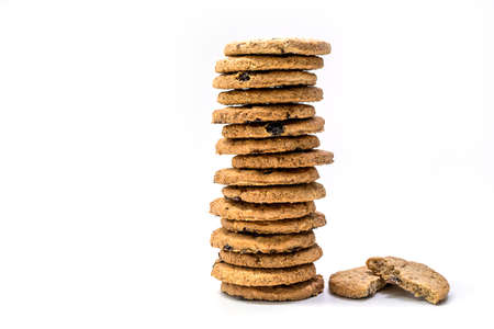 Close up delicious homemade milk cookie or biscuit with Raisin stack - isolated on white background with clipping pathの写真素材