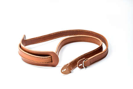 Brown leather camera strap isolated on white background. Isolated with clipping path includedの写真素材