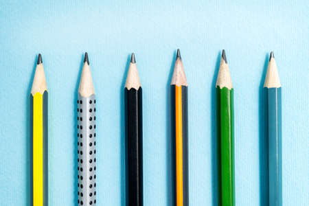 Six different graphite pencils on blue background. School and education conceptの写真素材