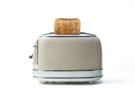 Retro toaster and toasted slices of bread isolated on white backgroundの写真素材