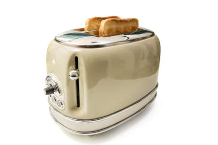 Retro toaster and toasted slices of bread isolated on white background with clipping pathの写真素材