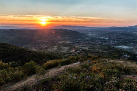 Beautiful mountain landscape. Panoramic view from mountains top. Attractive summer sunset scene. Discover the beauty of earth. Concept of outdoor recreation and relaxation.の写真素材
