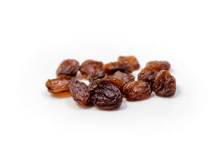 Raisins on white background, dried seedless grapes. Isolated Raisinの写真素材