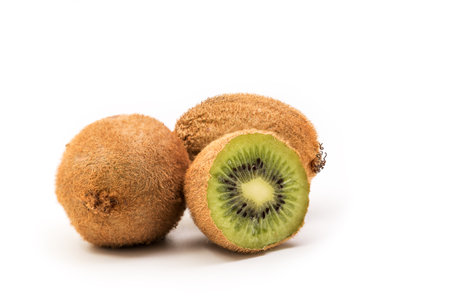 Kiwi Fruits Isolated on White Background, Whole kiwi fruit and half kiwi fruit isolatedの写真素材