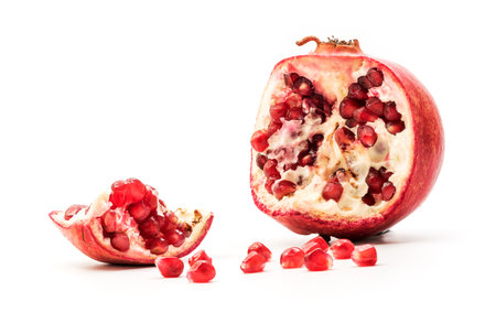 Pomegranate isolated part on a white background close-up . Fresh Garnet or pomegranate. Juicy Delicious pomegranate.の写真素材