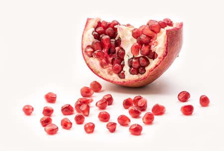 Pomegranate isolated part on a white background close-up. Fresh Garnet or pomegranate. Juicy...