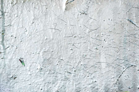 White painted concrete wall , Cement wall, cement texture background for design, Abstract white texture with cracks. Old wall painted in red. Grunge texture background, soft focusの写真素材