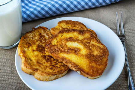 French toast - Przenice - slices of bread soaked in beaten eggs and milk and fried, with a glas of...