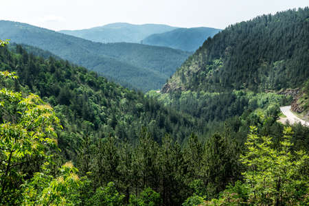 Mountain landscape view. Mountain layers landscape. Meadows and mountains landscape. Green mountains layers landscape. Top of the Mountainsの写真素材