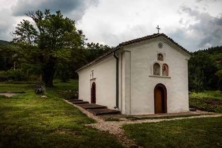 The Church of Saint Nicholas in the village of Manastir (Crkva Svetog Nikole, or Hram Svetog Nikolaja Mirolikijskog), 19th sentury church located in Sicevo Gorge, Serbia. Wind motiの写真素材
