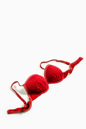 Red female bra isolated on white backgroundの写真素材