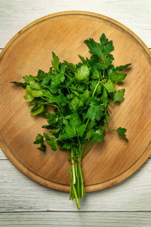 Fresh parsley on a cutting boardの写真素材