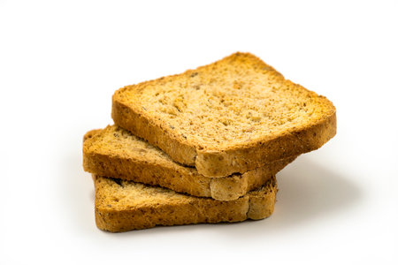 Crackers of dried rye bread, stacked on top of each other, white background. Crunchy rusk or toast for healthy life. Dieting foodの写真素材