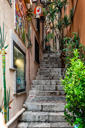 A characteristic narrow alley of Taormina, Sicily, Italyの写真素材