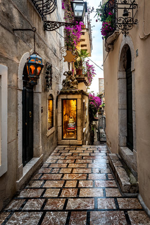 A characteristic narrow alley of Taormina, Sicily, Italyの写真素材