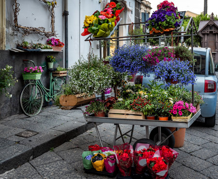 Small flower shop in streets of Acireale on Sicily, Italyの写真素材