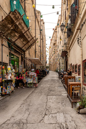 Palermo, Italy - May 18, 2023: Narrow Street with shops and restaurants in the city centre in Palermo, Sicily, Italyのeditorial素材