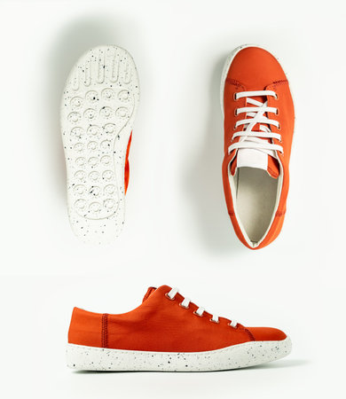 Red sneaker isolated on white background - three views, each is shot separatelyの写真素材