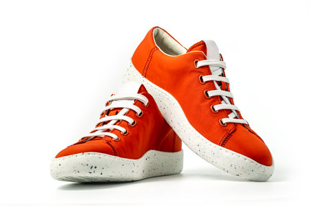 Red sneakers isolated on white backgroundの写真素材