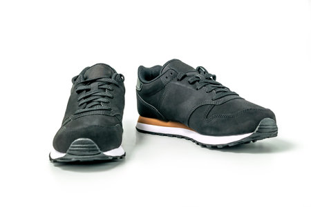 Black leather sneakers isolated on white background, clipping path includedの写真素材