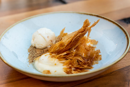 Delicious Greek sweet and crispy pastry named Galaktobourekoの写真素材