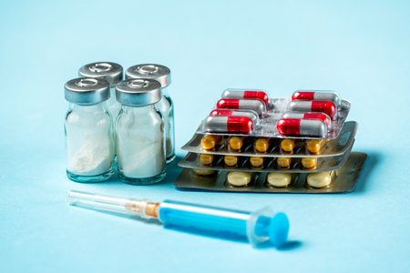 Variety of medicines and drugs. Pharmaceutical medicament, cure in container for health. Pharmacy theme, capsule pills with medicine antibiotic in packagesの写真素材