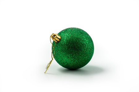 Green Christmas ball (sphere) isolated on whiteの写真素材