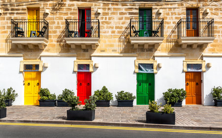 Marsaxlokk, Malta - Traditional maltese vintage house with orange, blue, yellow, red, green and...