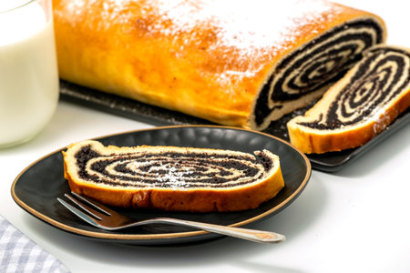 Homemade roll with poppy seeds and milk for breakfastの写真素材