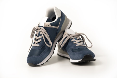 Blue leather sneakers isolated on white backgroundの写真素材