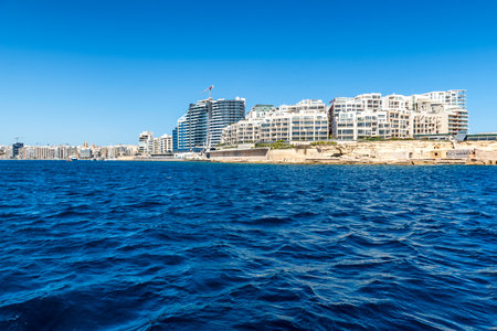 Modern business waterfront district of Sliema, Malta, near La Valletta - Mediterranean tourism travel destination. View from the seaの写真素材