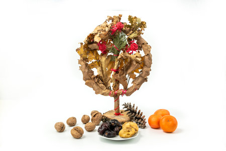 Orthodox Christian celebration - Badnjak with fruits. Serbian Christmas - Bozic. Badnjak grain and straw, isolated on white backgroundの写真素材