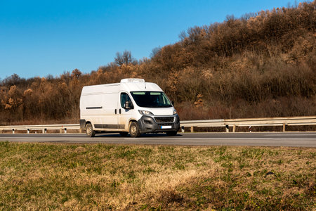 White cargo van at the open highwayの写真素材