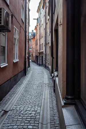 Sweden quaint cobblestone street in picturesque Gamla Stan, Stockholm's oldest neighborhood.の写真素材