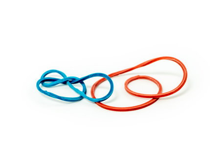 Blue and red  rubber bands isolated on white backgroundの写真素材