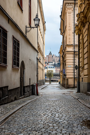 Sweden quaint cobblestone street in picturesque Gamla Stan, Stockholm's oldest neighborhood.の写真素材